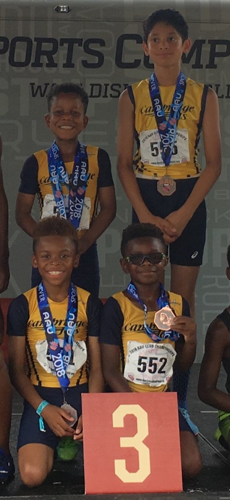 relay team at medals podium